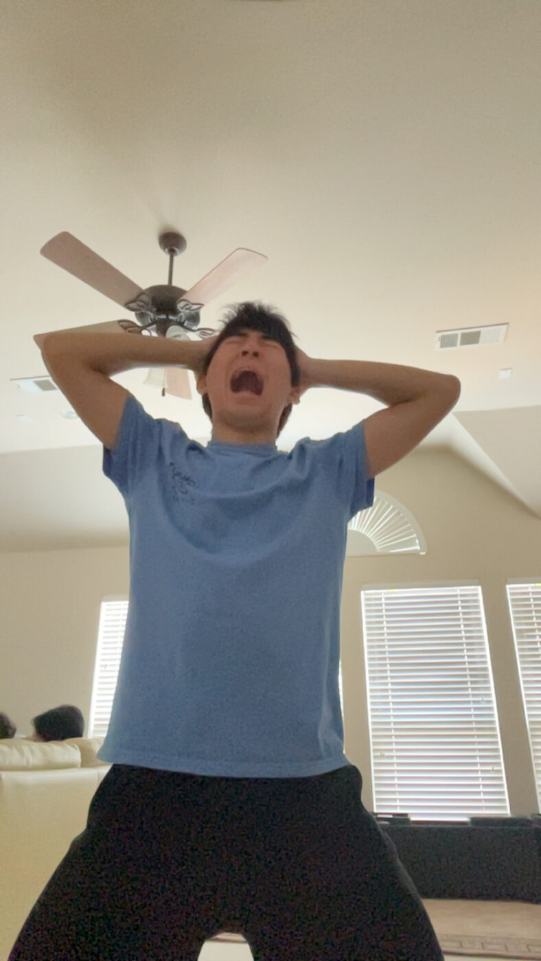 Nolan yelling with his hands on his head